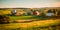 peaceful countryside Labor Day background featuring farms, barns, and rolling hills, illustrating the importance of