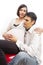 Peaceful Dreaming Caucasian Couple with Pregnant Woman Sitting Embraced Against White Background