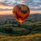 The peaceful drift of a hot air balloon over rolling hills