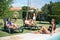 Peaceful female friends sunbathing near swimming pool