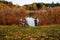 Peaceful fishing on the lake in autumn evening.