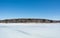 Peaceful frozen lake with blue sky