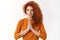 Peaceful good-looking cute redhead female yoga instructor, hold hands together in pray sign, say namaste finish