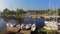 Peaceful harbor with many yachts at sunset. Outdoor activities