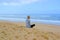 Peaceful healthy and fit young woman meditating on the beach. Yoga in the beach. Woman meditating in lotus pose.