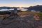 Peaceful hike in the morning sun rays under a blue sky toward the Lake Wanaka in New Zealand