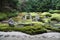 Peaceful Japanese Zen Garden with Pond, Rocks, Gravel and Moss