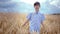 Peaceful and Joyful Young Boy Strolling Through a Breathtaking Golden Wheat Field and Savoring the Serene Natural Beauty