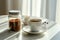 Peaceful morning scene featuring .glass jar filled with ground coffee, white coffee cup on sunlit table. Play of light, shadows