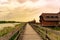 Peaceful nature at the Lake FertÅ‘ in Hungary with wooden pier bungalows cabins on the lake and straw in the water at