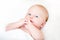 Peaceful newborn baby lying on a bed