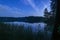 Peaceful night scene with the starry sky at a lake in Lithuania