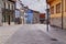 Peaceful pedestrian street made of tales and surrounded by colorful buildings in Luanco, Asturias