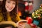 Peaceful redhead reading a book at christmas