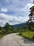 peaceful road and blue clear sky and white clouds