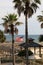 Peaceful scene of American flag tucked into curving pier leading people to the beach, Beach Club Resort, Gulf Shores,Alabama, 2018