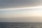 Peaceful and simple view over Mediterranean sea water with rocks and horizon at the end of the day