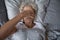 Peaceful sleepy senior woman awaking in her bed