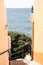 Peaceful small street with stairs and atlantic ocean in bacakground, in Madeira island