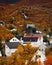 Peaceful small town surrounded by beautiful fall foliage in Northern Norway.