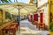 Peaceful street with sidewalk tables Lefkada town Greece