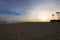 Peaceful sunset at the beach sand volleyball nets palm trees