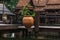 Peaceful thai floating architecture with traditional wooden house and bridge in Ancient City