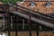 Peaceful thai floating architecture with traditional wooden house and bridge in Ancient City