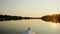 Peaceful view of beautiful sunset on river, riding a boat