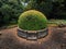 Peaceful view of lake and flowers in bloom at Biddulph Grange, Stoke-on-Trent, England