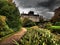 Peaceful view of lake and flowers in bloom at Biddulph Grange, Stoke-on-Trent, England