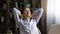 Peaceful young woman relax by desk take break in work