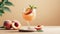 Peach cocktail in glass on beige background with copy space