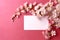 Peach flowers on branches against a wooden backdrop with text space