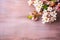 Peach flowers on branches against a wooden backdrop with text space