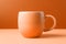 A peach fuzz color mug mock up on minimal orange background. Modern trendy tone hue shade