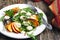 Peach and marinated mozzarella salad with fresh mixed greens