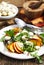 Peach and marinated mozzarella salad with fresh mixed greens