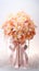 Peach orchids bouquet with ribbon bow on light background. Perfect for poster, greeting card, event invitation