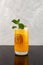 Peach and passion fruit cocktail with soda water. Refreshing summer drink. Iced fruit cocktail in tall clear glass decorated with