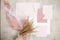 Peach pink pastel mock up composition of paper envelopes, seal wax, ribbons, hand craft jobbing. Weeding invitation. Top