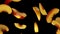 peach slices flying diagonally on black background in slow motion