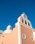 Peach and White Exterior of the Church of the Immaculate Conception in Santorini