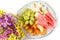 Peach, white grape, watermelon, melon on the plate and dried flowers