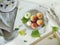 Peaches, apples, plums, leaves on plates on a light background