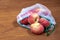 Peaches in ecological packaging. Reusable bags for vegetables and fruits. Shopping in the store, retail. Eco friendly packaging of