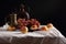 Peaches, grapes and vintage jugs on a white tablecloth