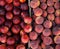 Peaches and nectarines on the counter for sale in a grocery shop.