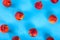 Peaches pattern. Top view of fresh fruits on a blue background. Repetition concept