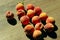 Peaches scattered on a wooden table, top view, horizontal image.